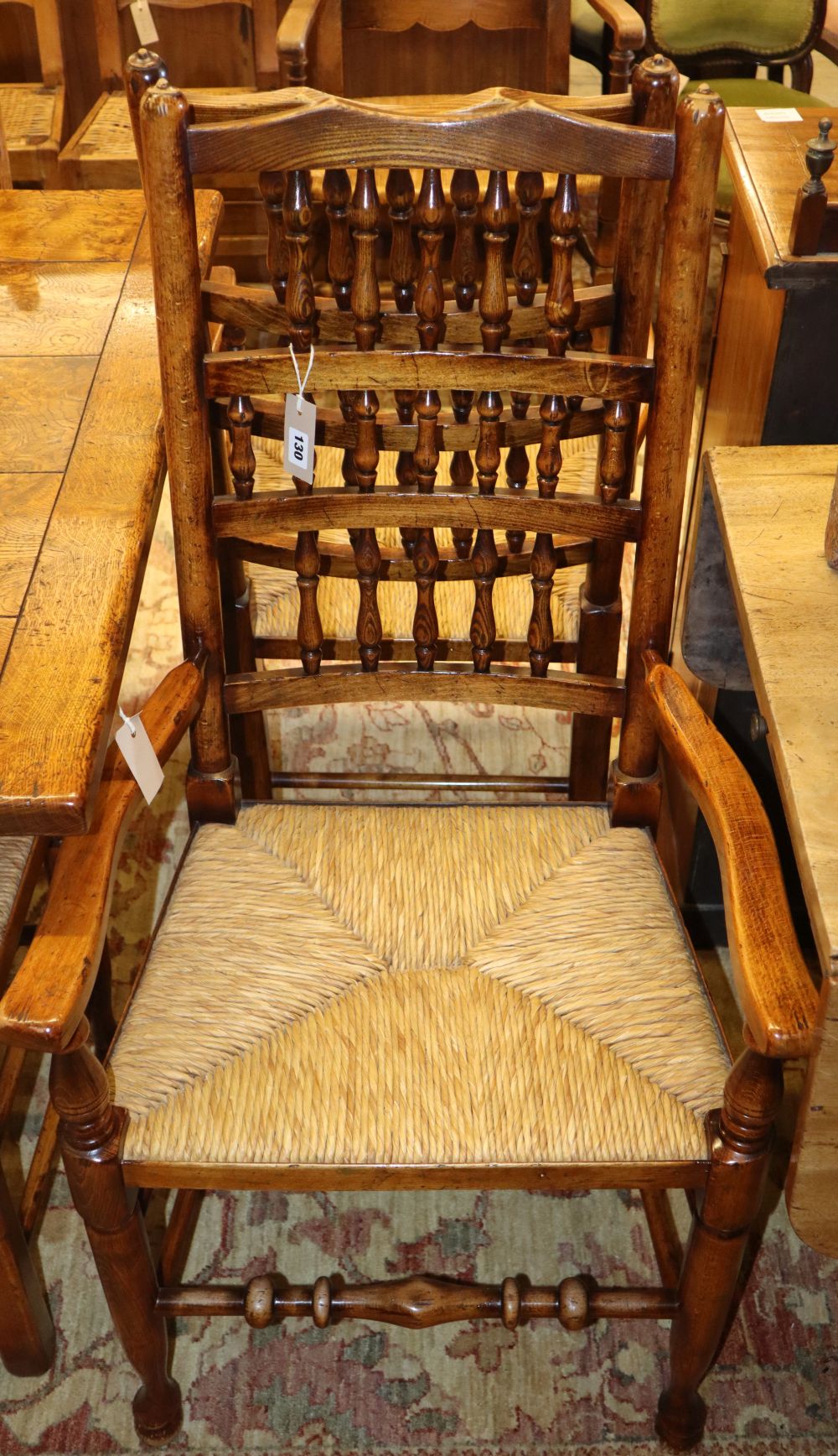 A set of twelve 19th century Lancashire style oak rush-seat dining chairs (two with arms)